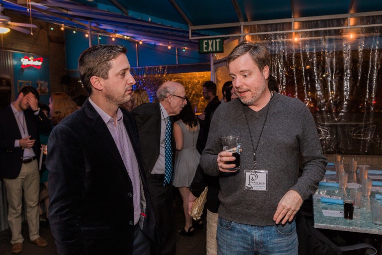 Matt LeClercq and Michael Workman talk during the dinner party. Photo by Erik Perel