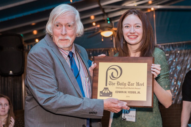 Maddy Will presents Ed Yoder with the Distinguished Alumni Award. Photo by Erik Perel